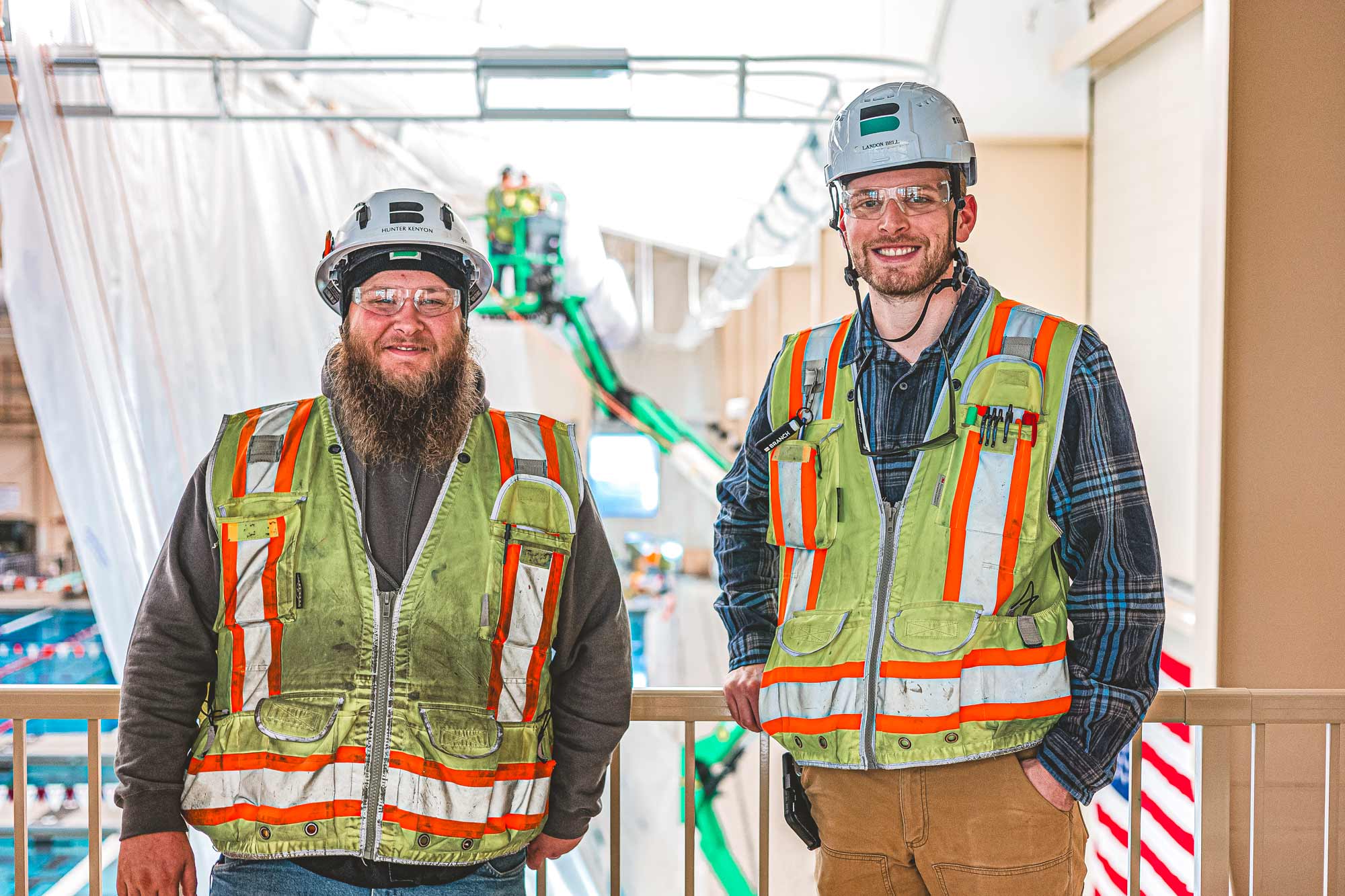 Smiles and thumbs up from four employees